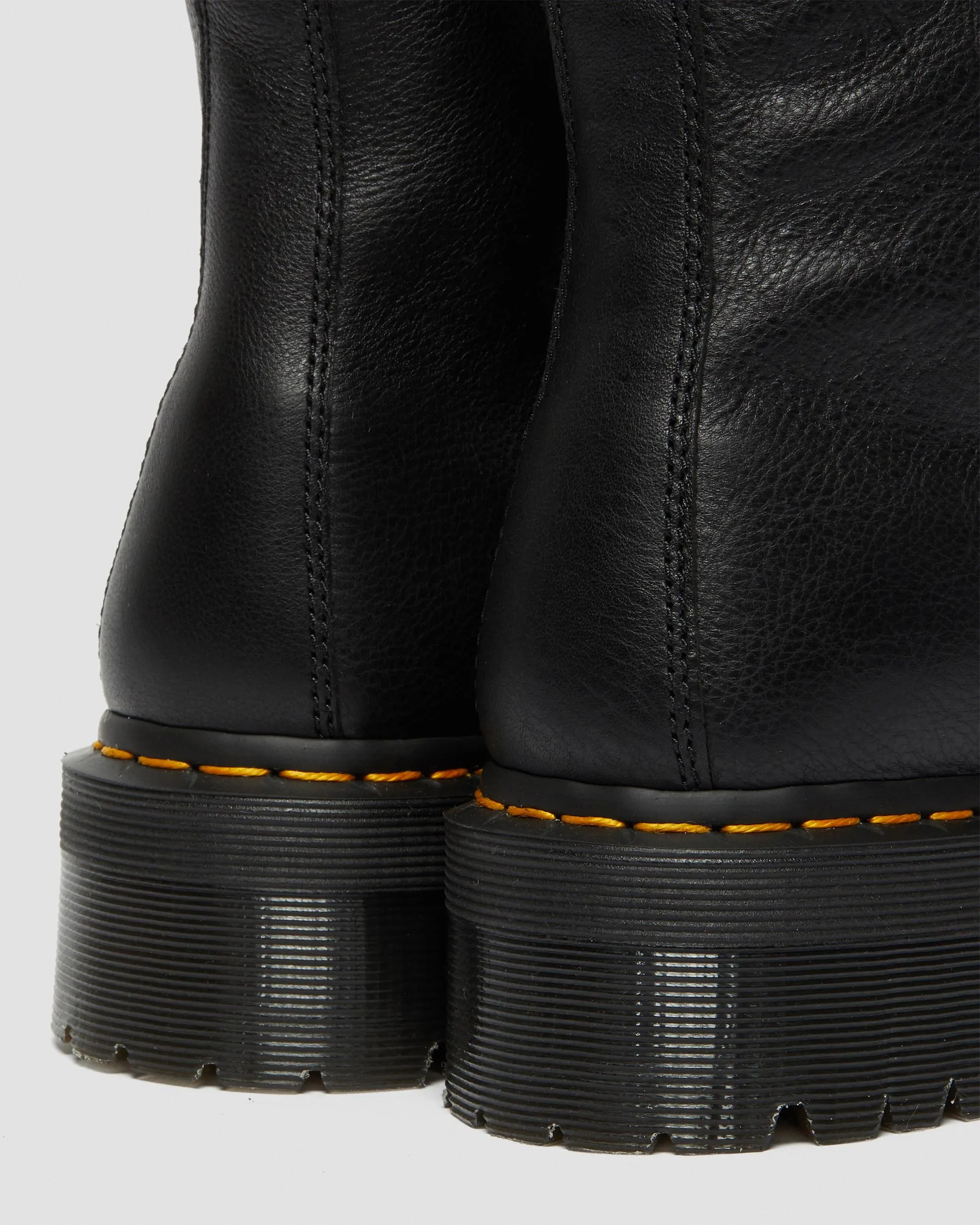 Dr. Jadon leather platform boots with faux fur lining. Martens