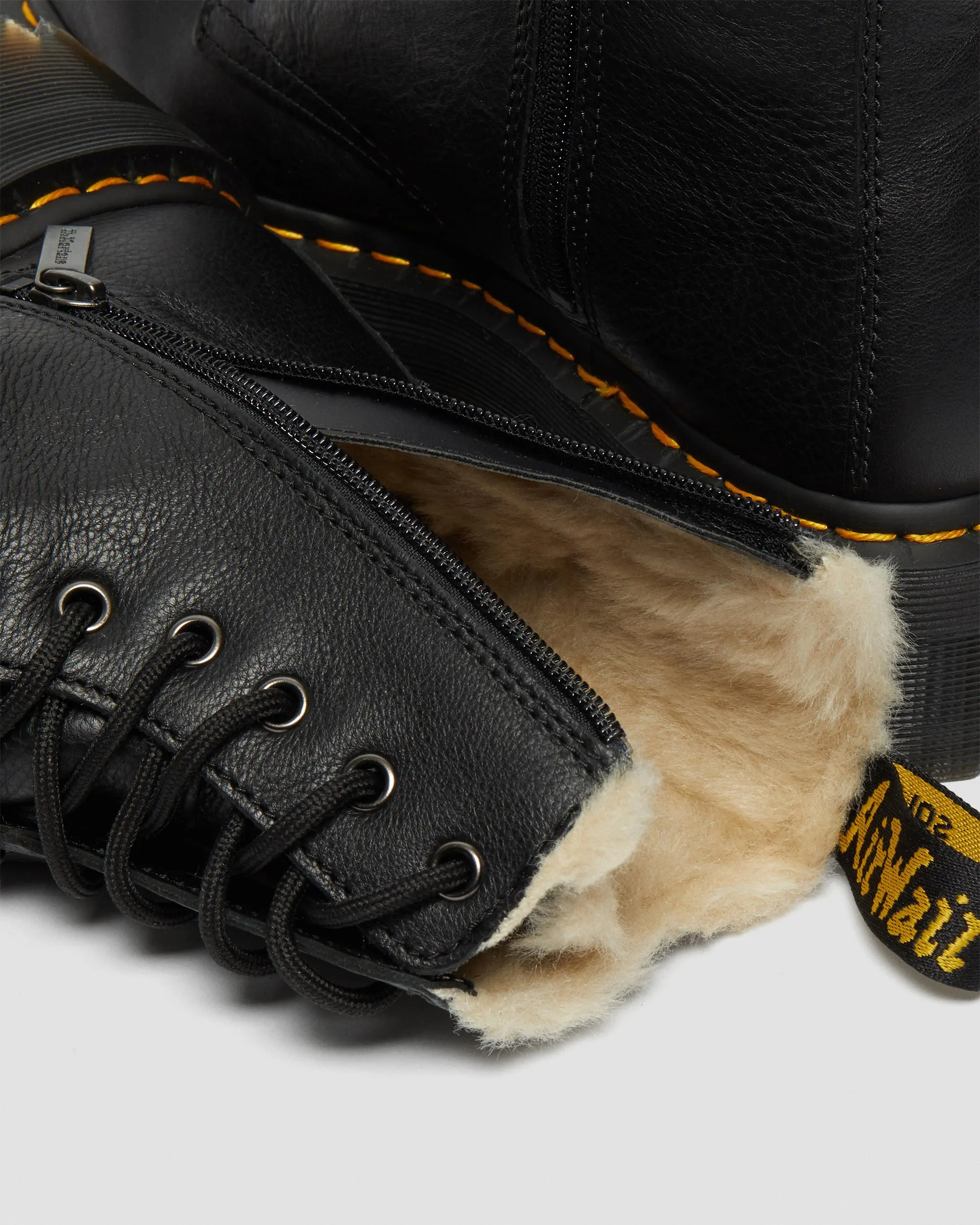 Dr. Jadon leather platform boots with faux fur lining. Martens