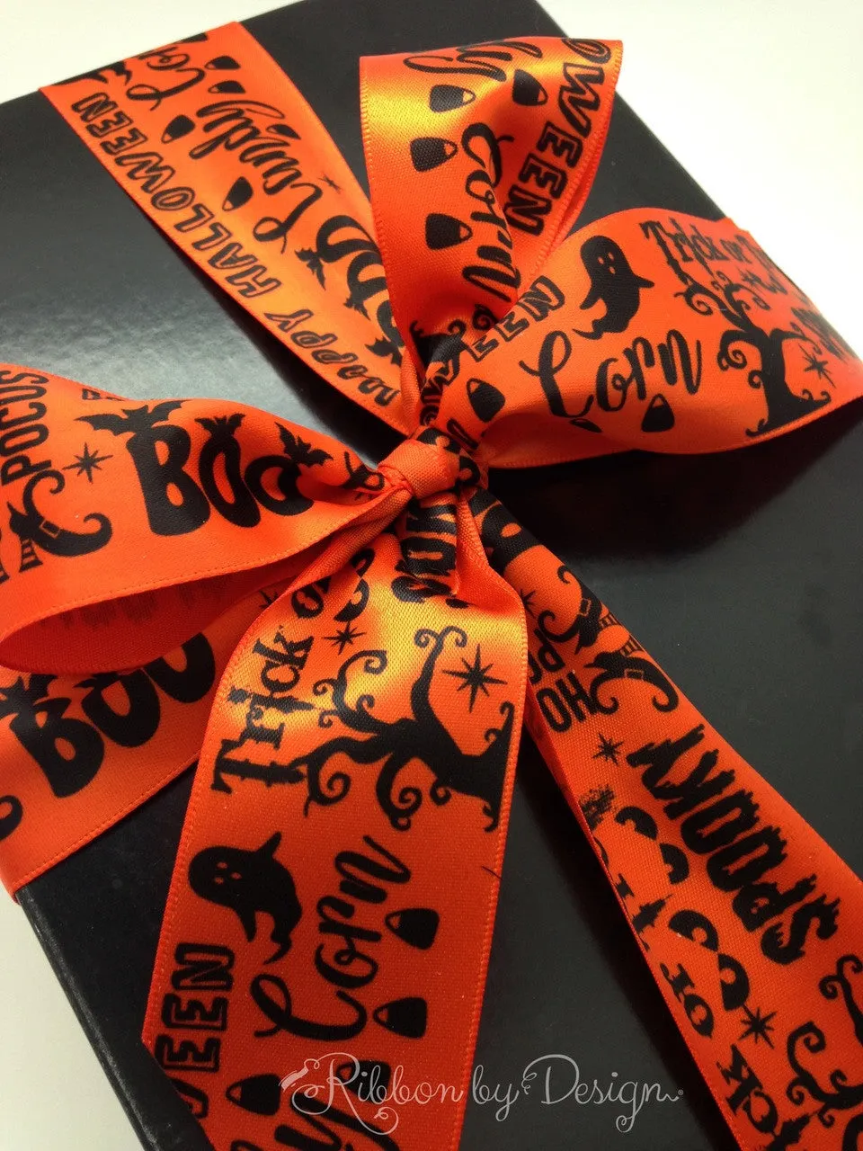 Halloween Word Block Ribbon black text with Halloween elements printed on 1.5" orange ribbon